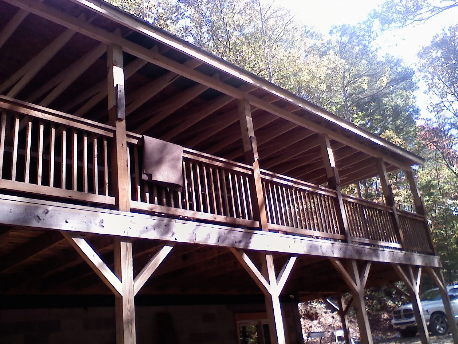 Timber framing under a new elevated porch and deck — Roof Leak Repair in New Church by Roofing Brothers
